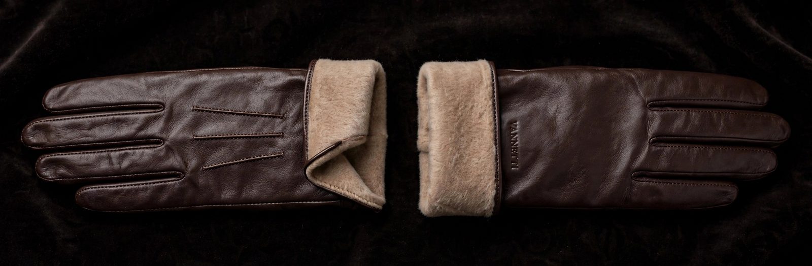 Brown leather dress gloves with a warm lining